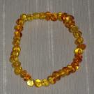 -NBF04-Bracelet-Ambre-miel-clair-uni-petites-perles-semi-rondes-monte-sur-elastique